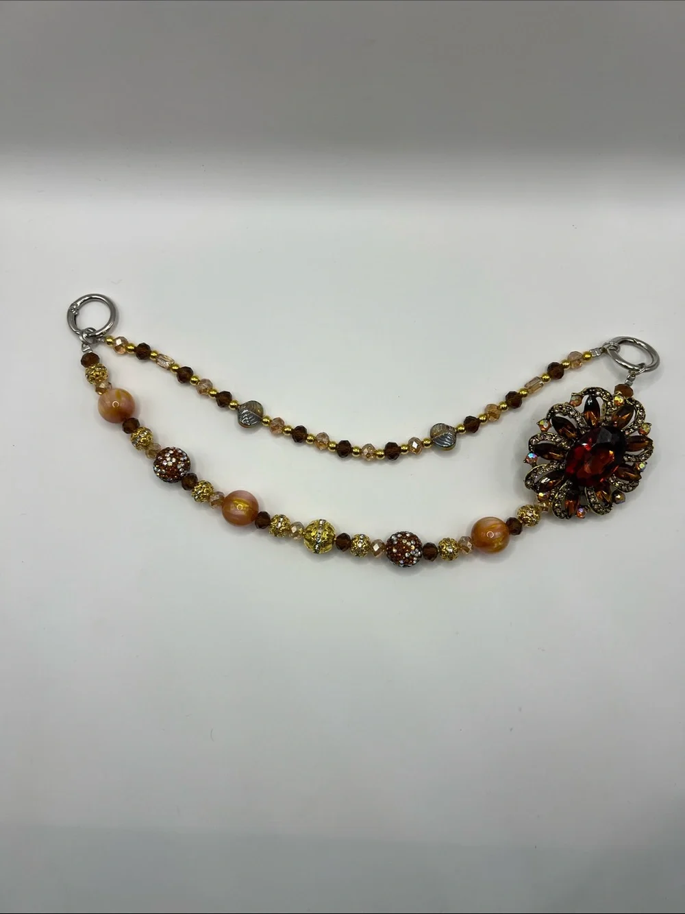 745. Vintage-Inspired Amber Beaded Bag Chain with Floral Accent